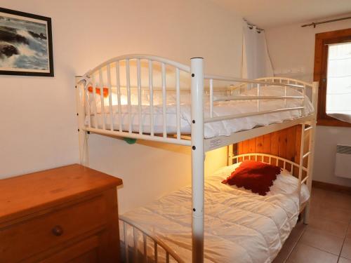 a bedroom with two bunk beds and a desk at Appartement Samoëns, 3 pièces, 4 personnes - FR-1-624-63 in Samoëns
