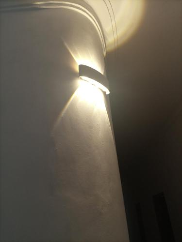 a light on a pole in a room at Pearl Motel Buloba in Buloba