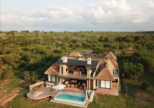 an aerial view of a house with a swimming pool at Jacana River Lodge Mjejane Game Reserve in Hectorspruit