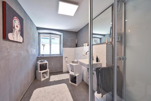 a bathroom with a sink and a shower at Exklusives und Modernes Bauernhaus in Nesselwang