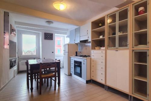 a kitchen with a table and a dining room at Scorci Di Mare in Riomaggiore