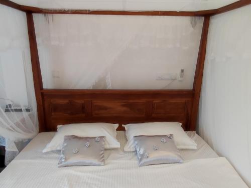 Postel nebo postele na pokoji v ubytování Flower Shade Villa