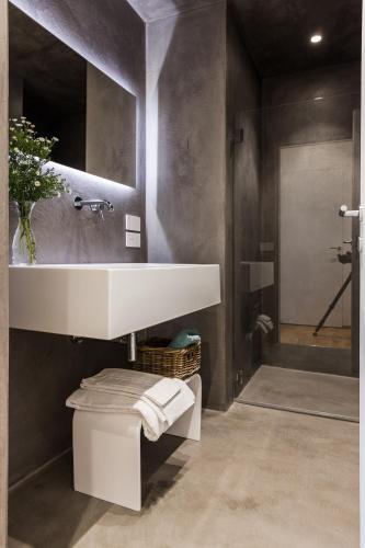 a bathroom with a white sink and a shower at Ca' de Ma in Diano Marina
