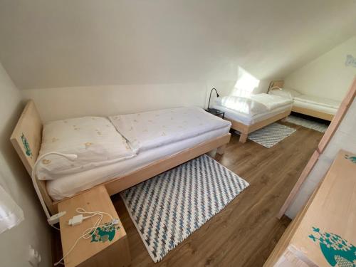 a small room with two bunk beds in it at Evin*raj in Kvačany