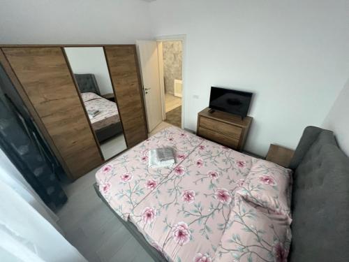 En eller flere senge i et værelse på R&C Relax Apartment 808