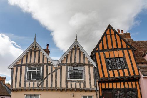 two old half timbered houses in a city at Georgina in Lavenham