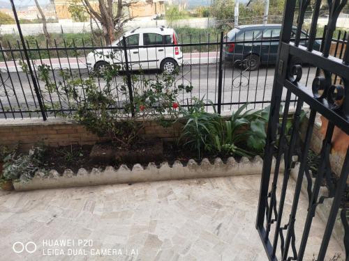 a fence with a bunch of plants in a garden at APE REGINA Rignano Gramsci in Rignano Flaminio