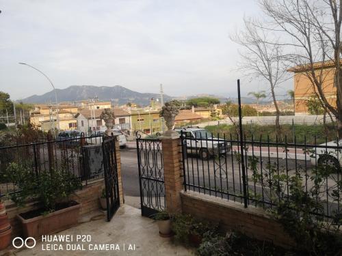 a wrought iron fence with a view of a street at APE REGINA Rignano Gramsci in Rignano Flaminio