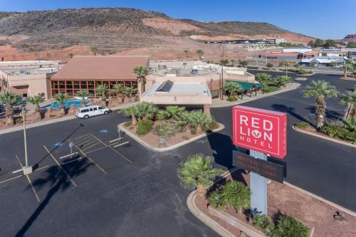 a red lion motel sign in front of a parking lot at Red Lion Hotel and Conference Center St. George in St. George