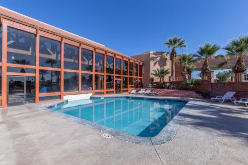 a swimming pool in front of a building at Red Lion Hotel and Conference Center St. George in St. George