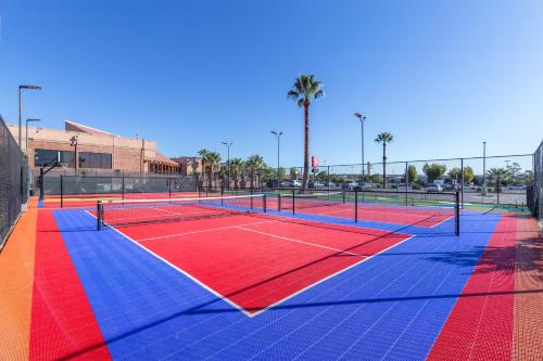 a tennis court with red and blue at Red Lion Hotel and Conference Center St. George in St. George