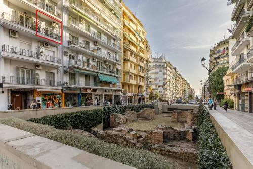 a street in a city with tall buildings at NAVA Apartment in the center with private parking of stayinthess in Thessaloniki