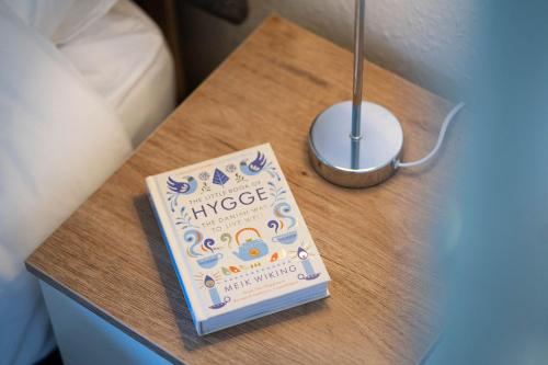 a book sitting on top of a table at Beautiful detached home in quaint village setting in Wetherby