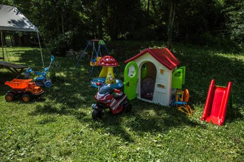 a group of childrens toys in the grass at Grab cabin in Pluzine