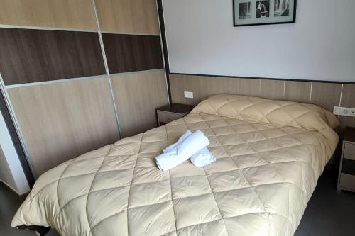 A bed or beds in a room at Ático dúplex Gran Vía Granada
