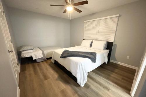 a bedroom with a bed and a ceiling fan at Stone Mountain's Hidden Secret in Stone Mountain