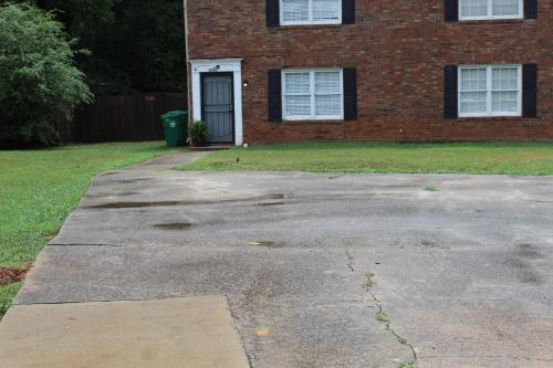a driveway in front of a brick house at Stone Mountain's Hidden Secret in Stone Mountain