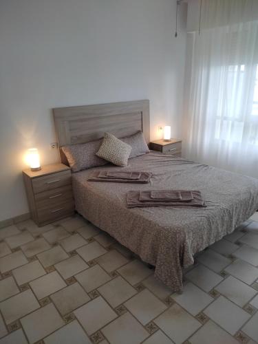 Un pat sau paturi într-o cameră la Aguadulce playa