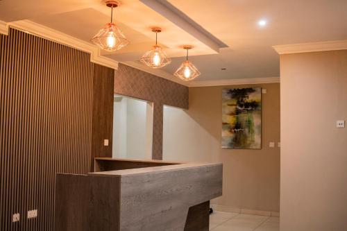 a lobby with a counter with lights on it at Pahotela Bed and Breakfast in Palatswe