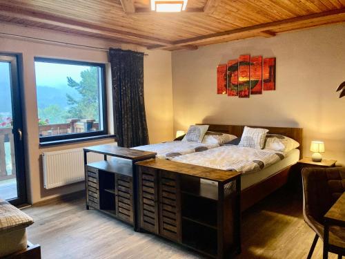 Posteľ alebo postele v izbe v ubytovaní Apartmány Na Výsluní České Švýcarsko