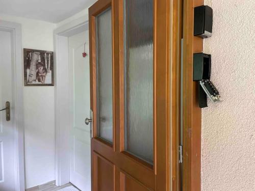 a wooden door in a room with a door at Srní- Červený byt/ dvojdomek u hotelu Vydra in Srní