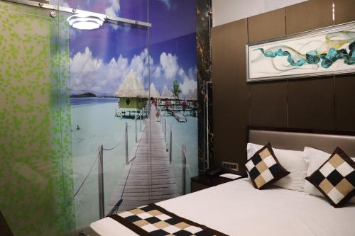 a bedroom with a window with a view of a pier at Hotel Shivam Palace 1 Km from Railway Station 1 Km from Bus Stand in Ajmer