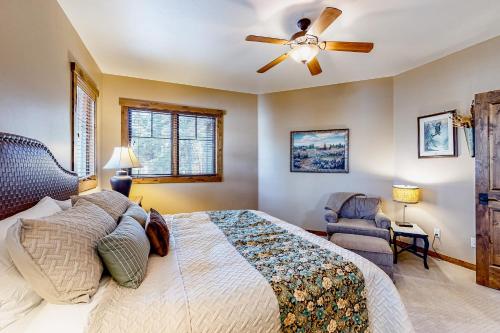 a bedroom with a bed and a ceiling fan at BOTHR Steelhead in McCall