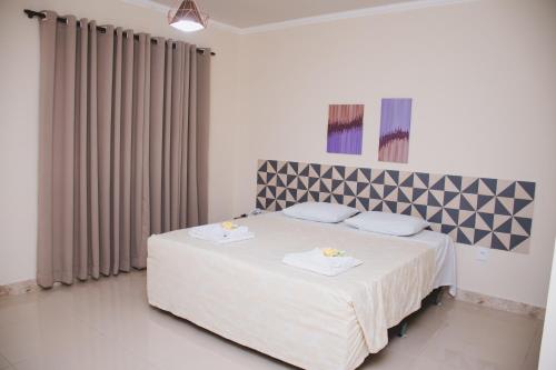 Katil atau katil-katil dalam bilik di CALDAS PALACE HOTEL JORRO