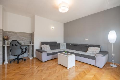 a living room with a couch and a chair at Holiday House Tone, Imotski-Drum-Makarska in Drum