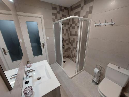 a bathroom with a shower and a sink and a toilet at Acea Nova 2 in Monforte de Lemos