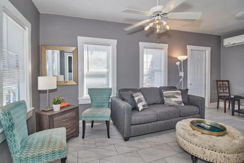 a living room with a couch and chairs at Gorgeous Loft Apartment Centrally Located Tampa in Tampa