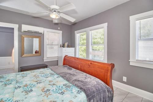 a bedroom with a bed and a ceiling fan at Gorgeous Loft Apartment Centrally Located Tampa in Tampa