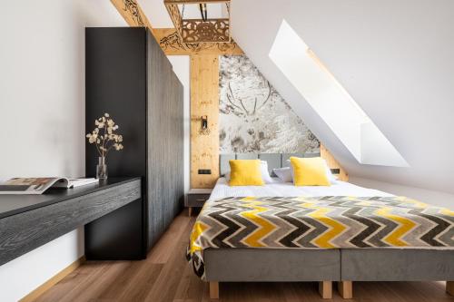 Łóżko lub łóżka w pokoju w obiekcie Apartamenty Polana pod Nosalem - na samym stoku