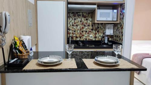 Kuchyň nebo kuchyňský kout v ubytování Kitnet completa com home office, vaga coberta e local nota 10!