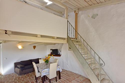 a living room with a couch and a table at Villa Fragola in Motovun