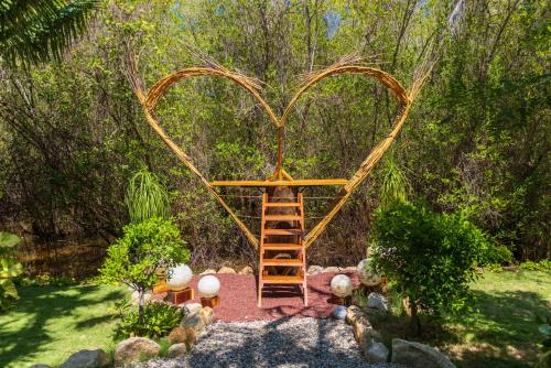 a swing in the shape of a heart with a ladder at Muúnek Hotel Boutique Art & Spa, adults only in Barra Vieja