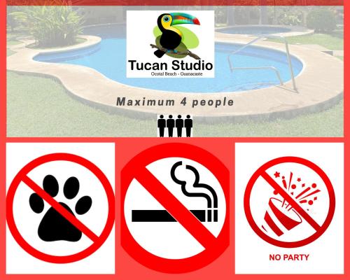a group of signs in front of a pool at Tucan Studio Ocotal in Coco