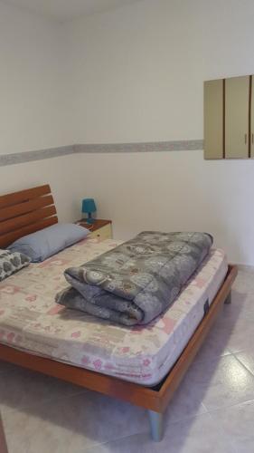 two beds sitting in a room with at Residence Anna in Paestum