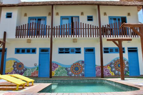 a house with a mural on the side of it at MAKTUB PREA HOSTEL in Prea