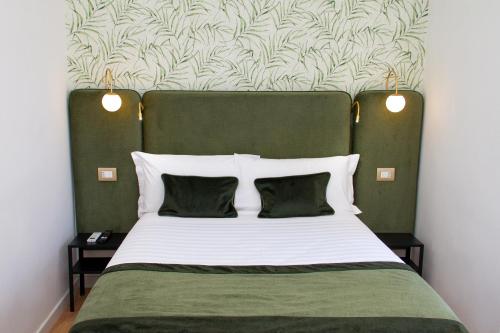A bed or beds in a room at Home at Rome St. Peter Guest House