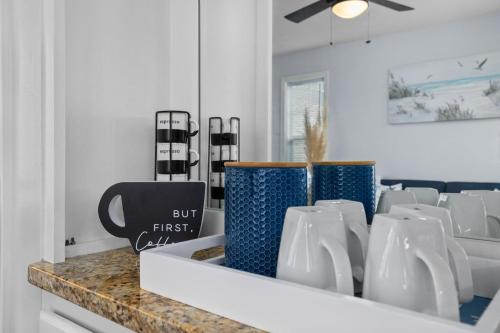 a counter with vases on it in a room at Fully equipped 2BR 2BA with King Bed in heart of MB in Myrtle Beach