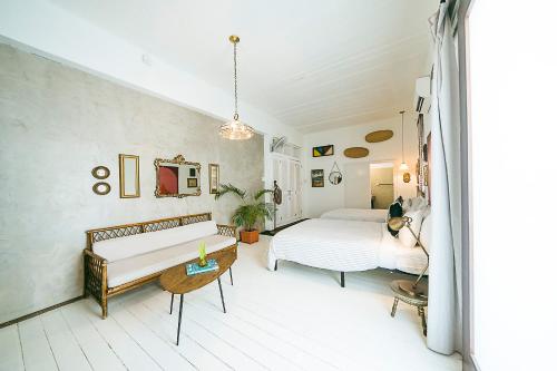 Una cama o camas en una habitación de Casa Botanica Hotel