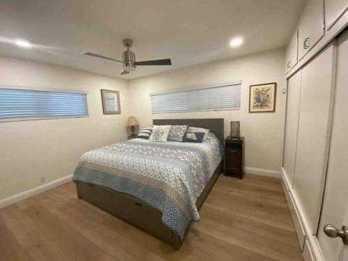 a bedroom with a bed and a ceiling fan at Blue Whale Inn San Clemente Retreat Unit E in San Clemente