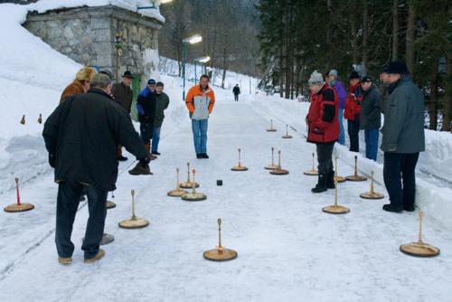 a group of people playing a game in the snow at Werfenerhof in Werfen