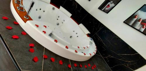 a white boat with red hearts on a counter at L'OLYMPE DES SENS in Portiragnes