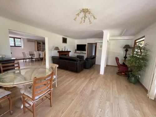 a living room with a table and a dining room at Charming Villa Saint-Jean-Cap-Ferrat in Saint-Jean-Cap-Ferrat