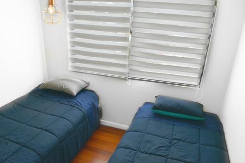 Cama o camas de una habitación en Precioso departamento ubicado en Santiago