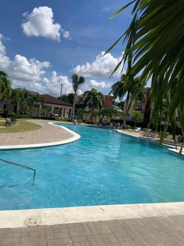 a large pool with blue water in a resort at VIP Home in Santiago de los Caballeros