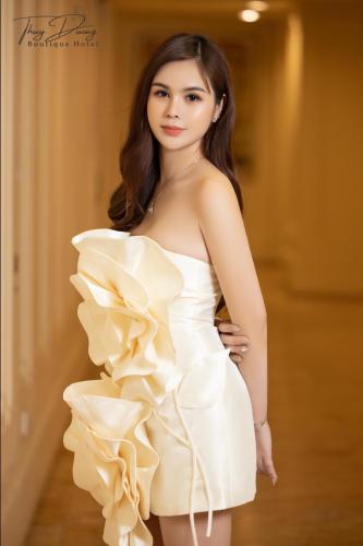 a young woman in a white dress at Thuy Duong Boutique Hotel Hue in Hue