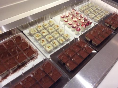 a display case filled with lots of different types of chocolate at Hotel Ariston & Apartments in Varazze